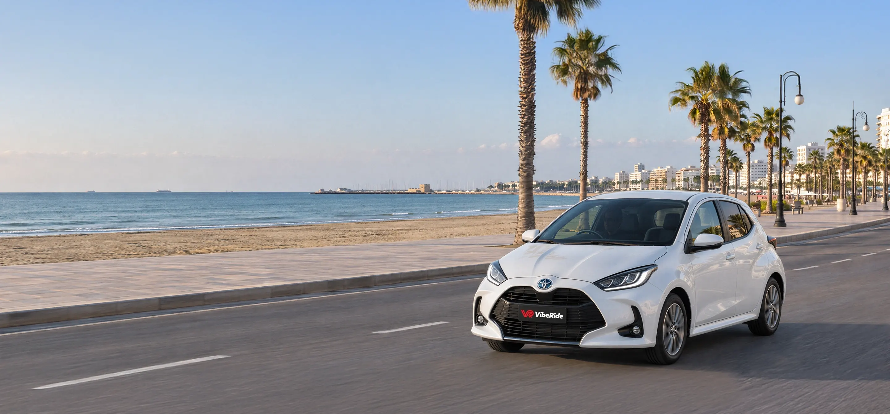 A VibeRide hire car on a coastal road in Cyprus